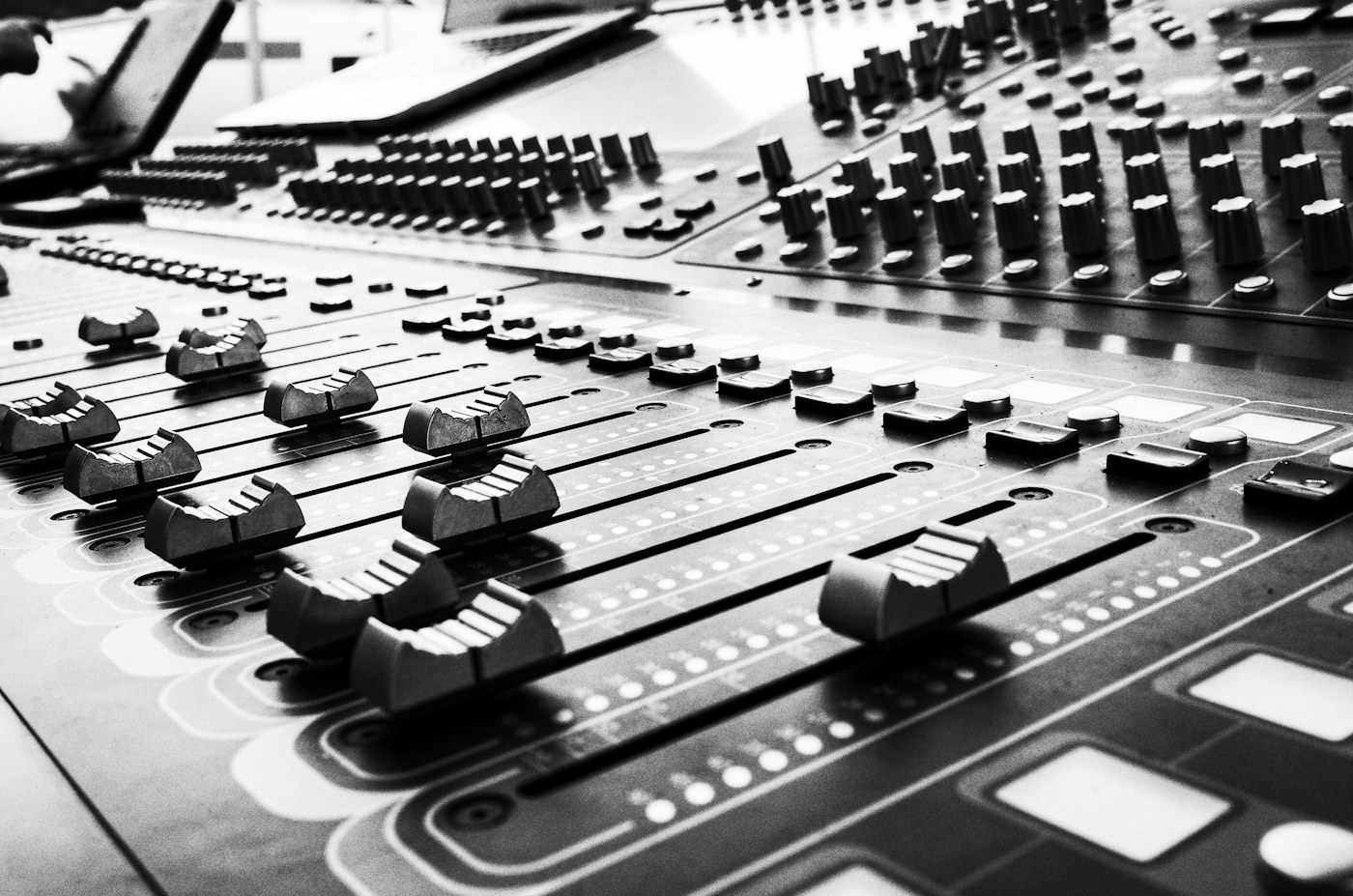 Close-up of a professional audio mixing console